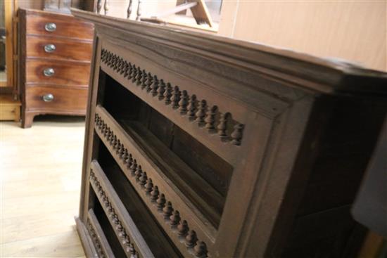 An 18th century French provincial walnut hanging wall shelves W.134cm